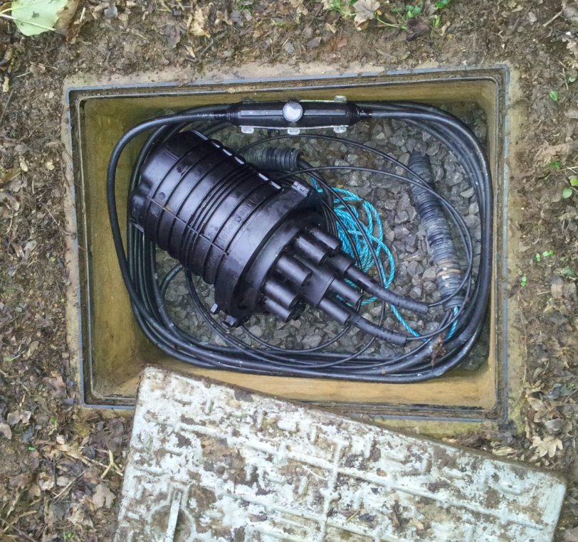 Open manhole showing a joint enclosure